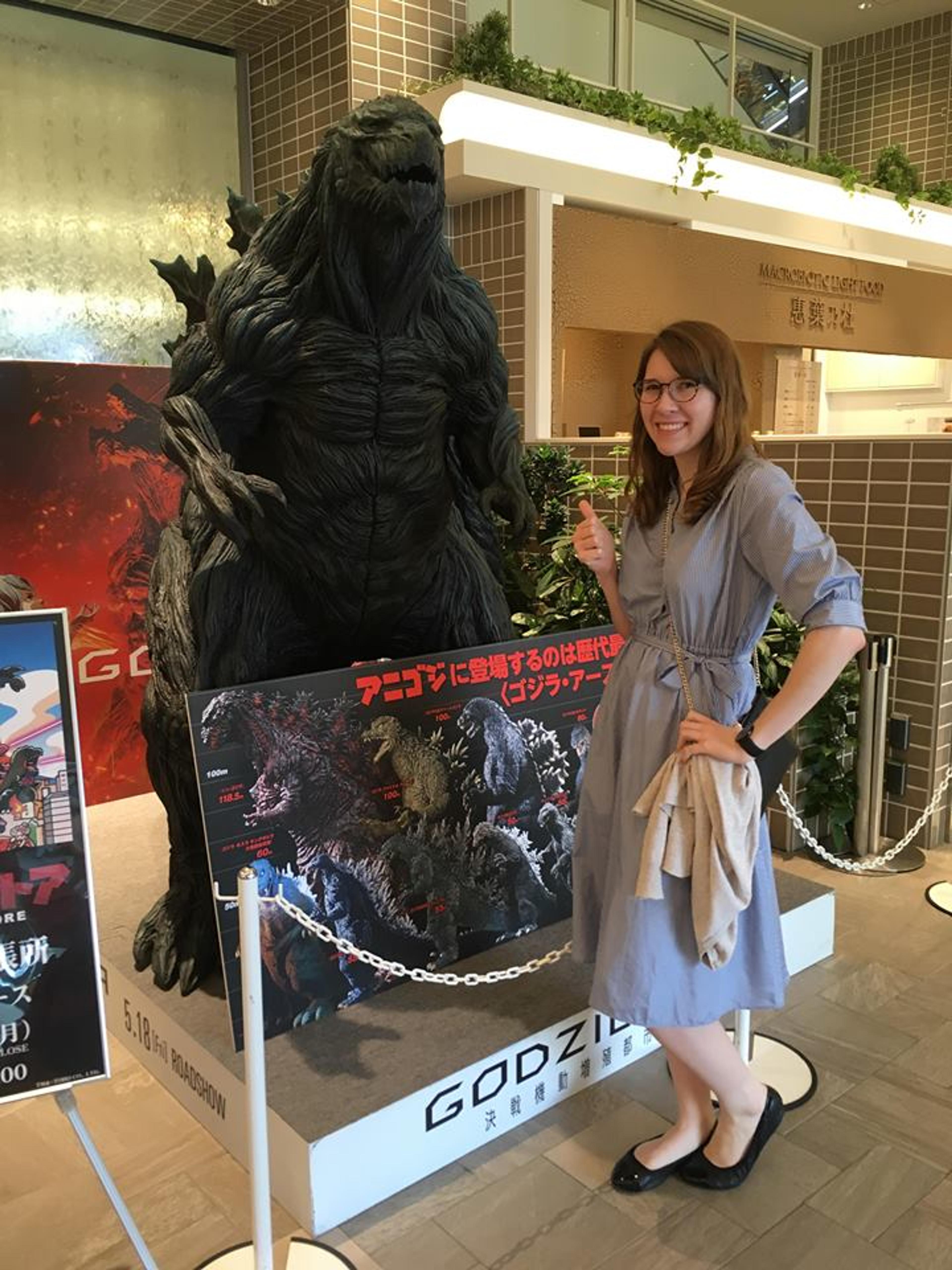 Terra in front of a Godzilla display. 