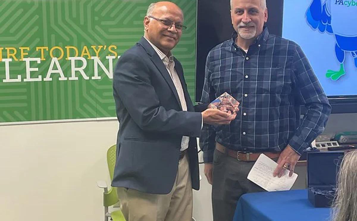 Wilkes University's Prahlad Murthy receives his award