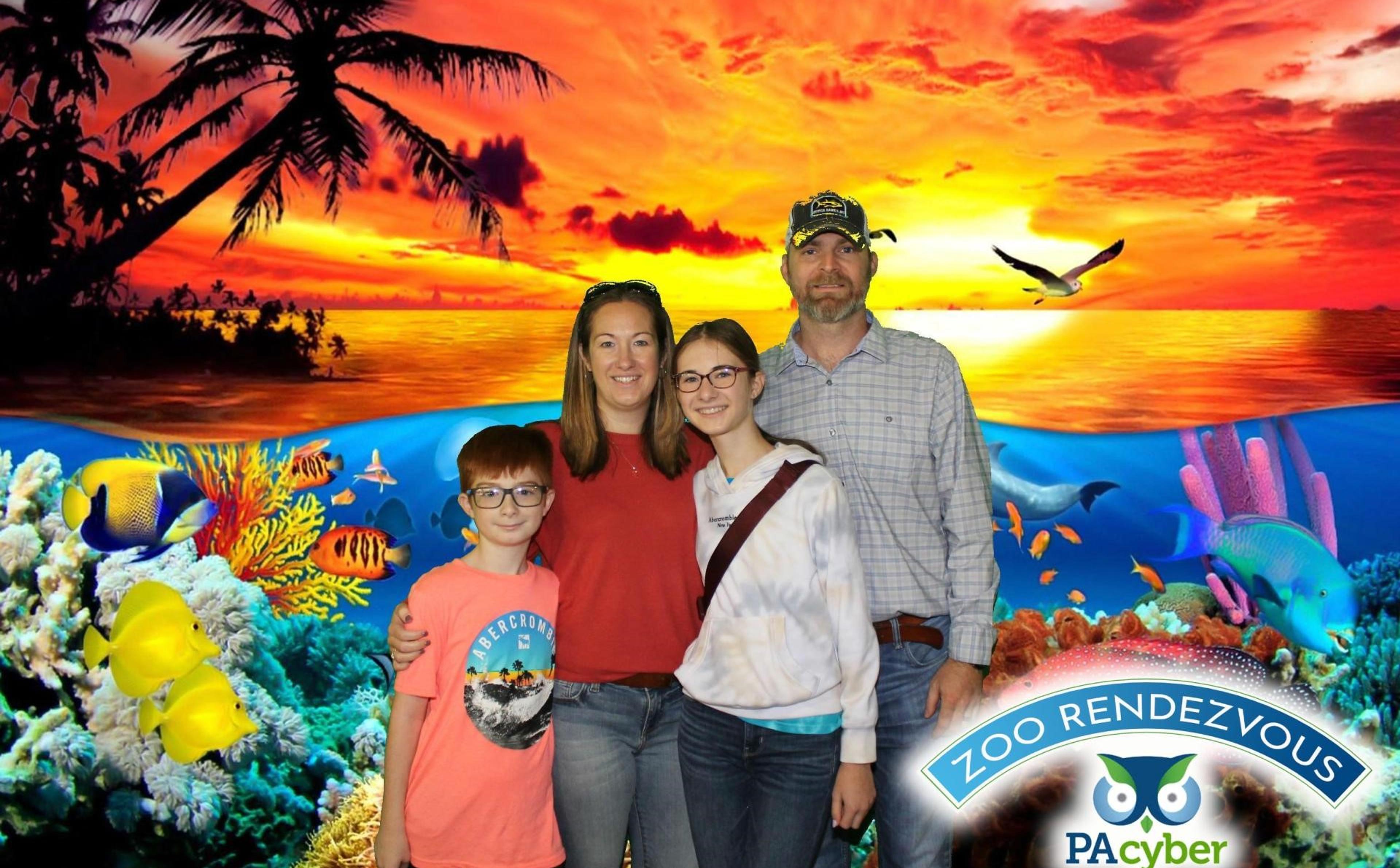 Mother, father, son, and daughter pose in front of an illustrated background of a sunset and tropical fish.