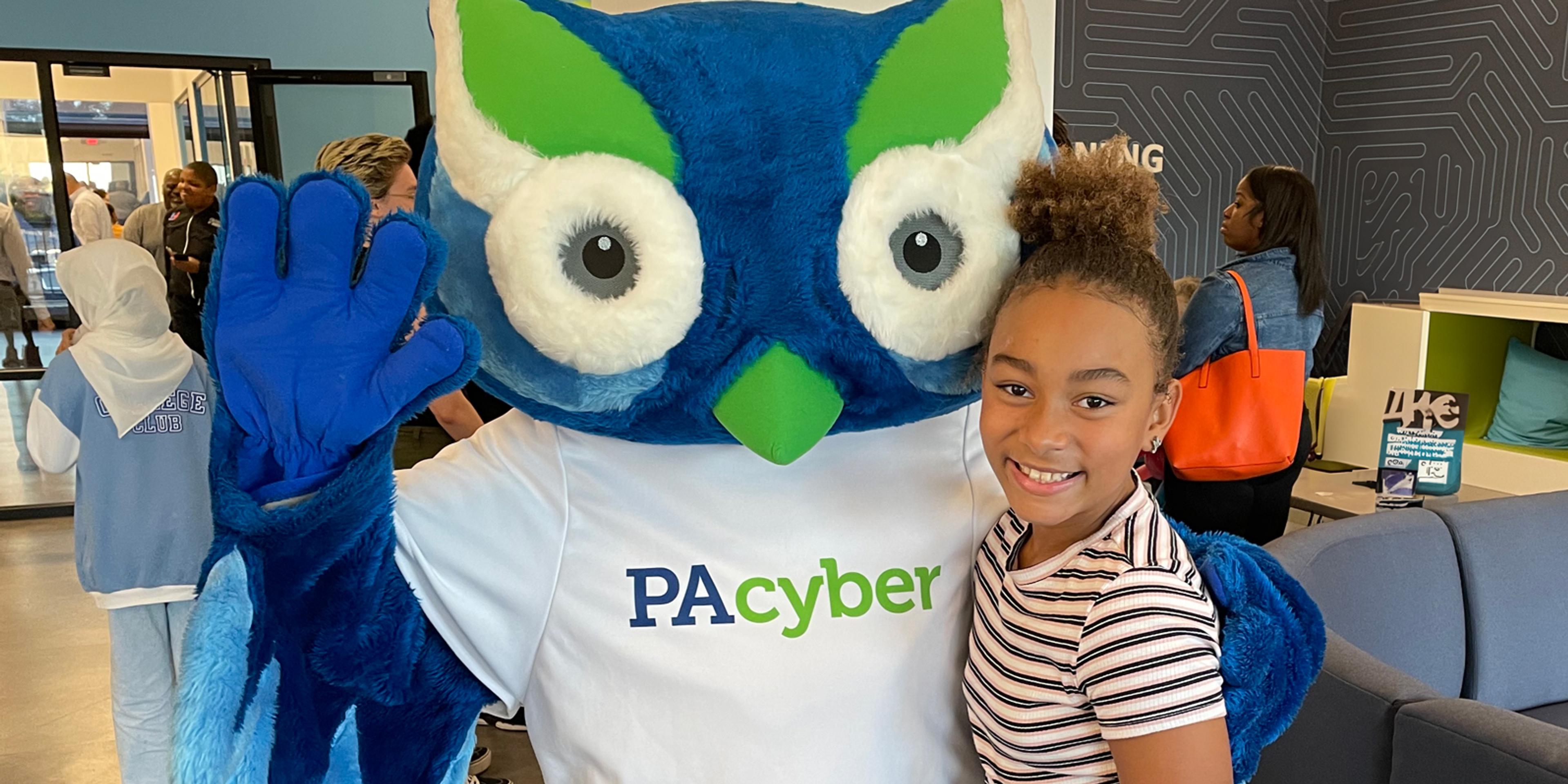 Student with Archie at a kick off event