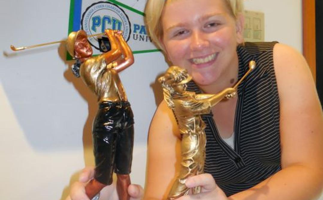Amanda holding Golf awards