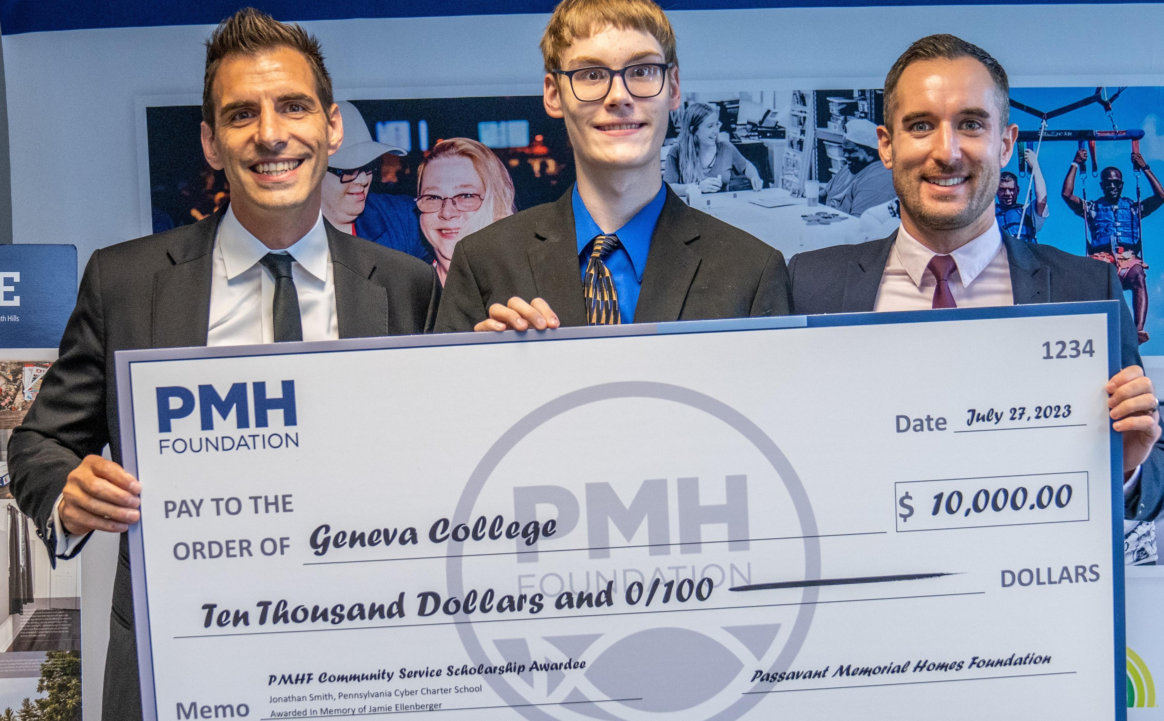 Student and two men stand behind a large check made out to Geneva College for $10,000.