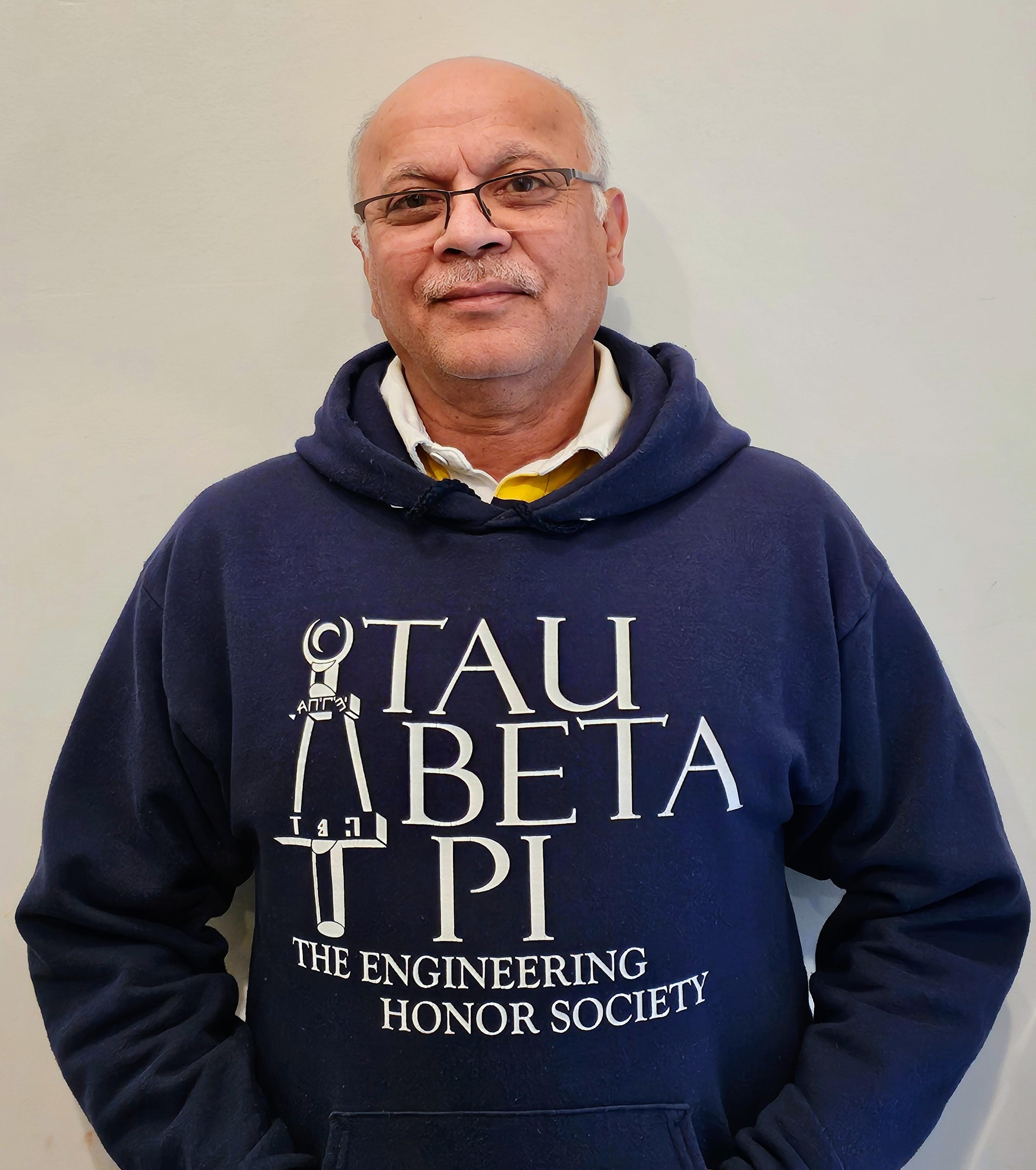 Dr. Murthy wears a sweatshirt representing Tau Beta Pi, the Engineering Honor Society. 