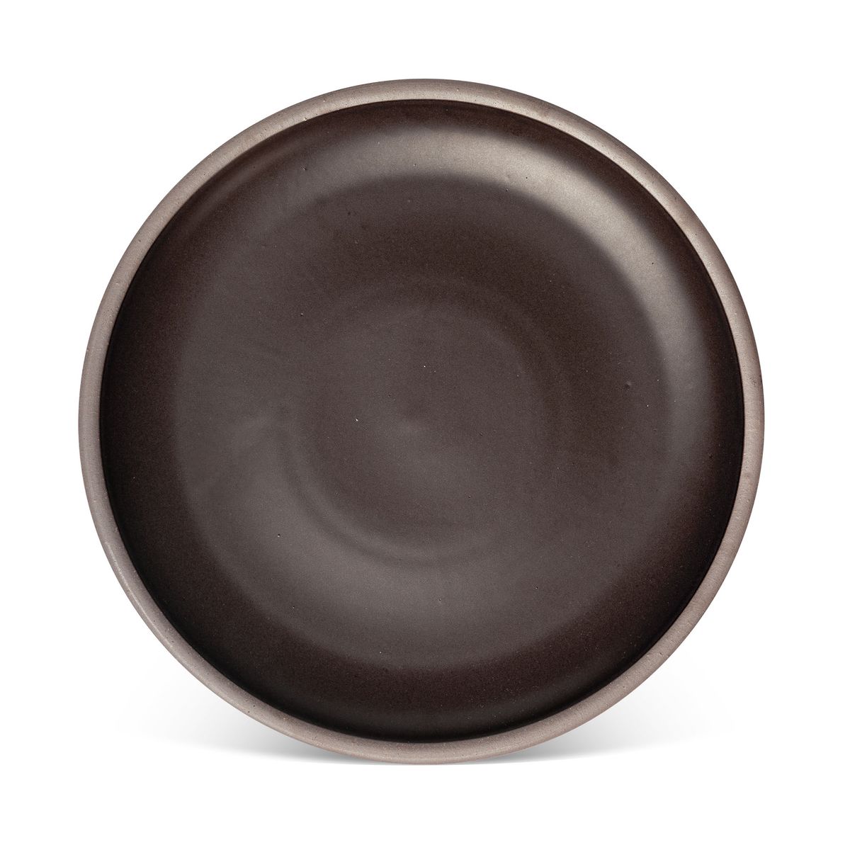 A large ceramic platter in a dark cool brown color featuring iron speckles and an unglazed rim
