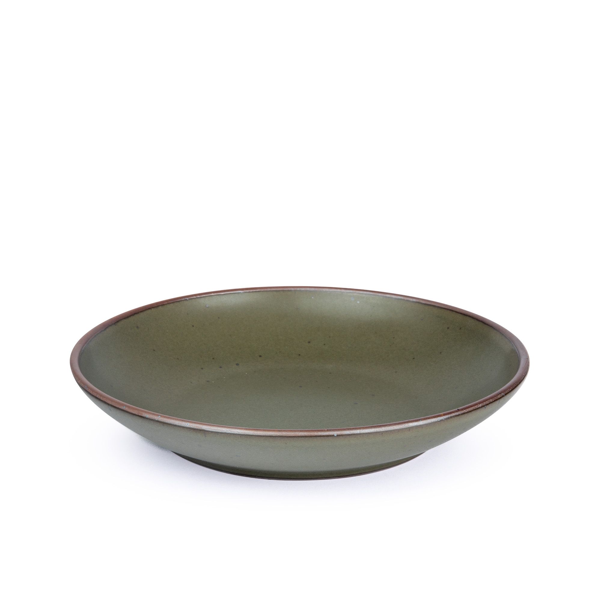 A large ceramic plate with a curved bowl edge in an earthy green color featuring iron speckles and an unglazed rim.