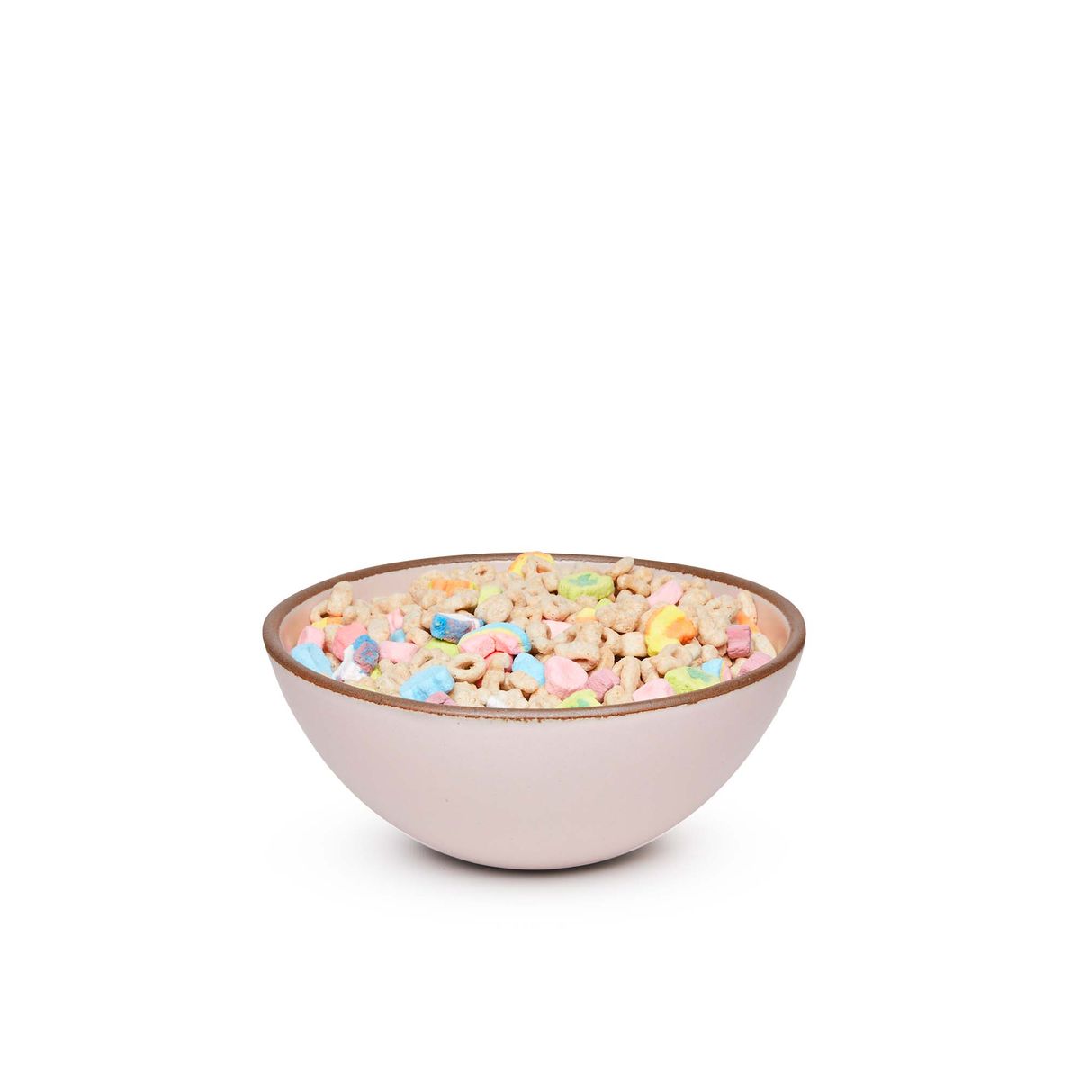 A medium rounded ceramic bowl in a soft light pink color featuring iron speckles and an unglazed rim, filled with cereal