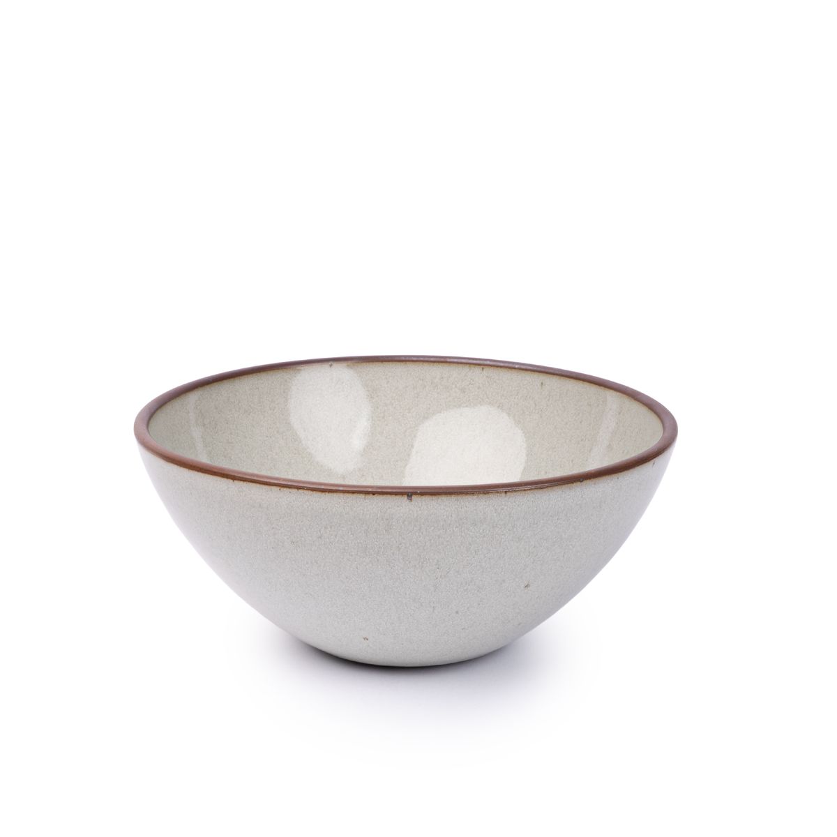A large rounded ceramic bowl in a reflective icy off-white color featuring iron speckles and an unglazed rim