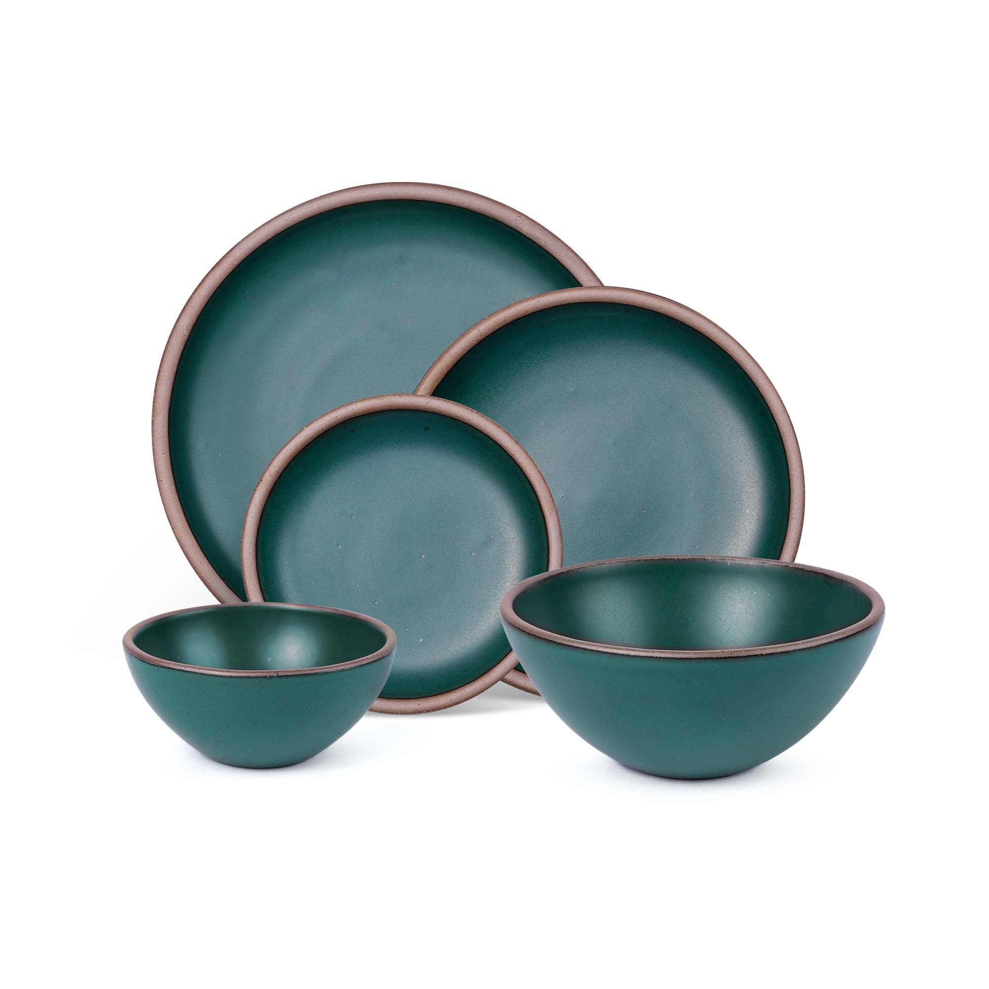 An ice cream bowl, soup bowl, cake plate, side plate and dinner plate paired together in a deep dark teal featuring iron speckles