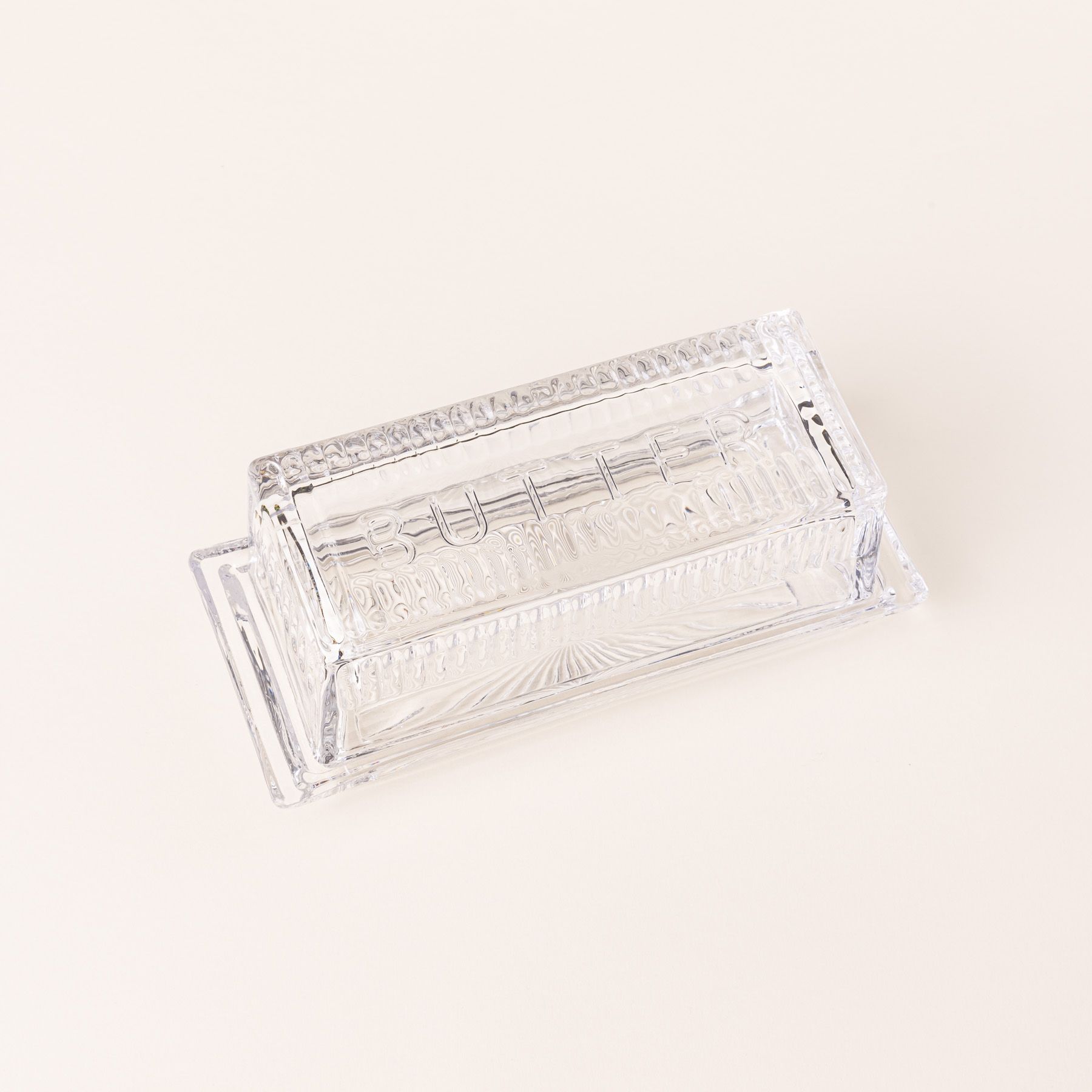 Traditional glass butter dish with 'Butter' on top