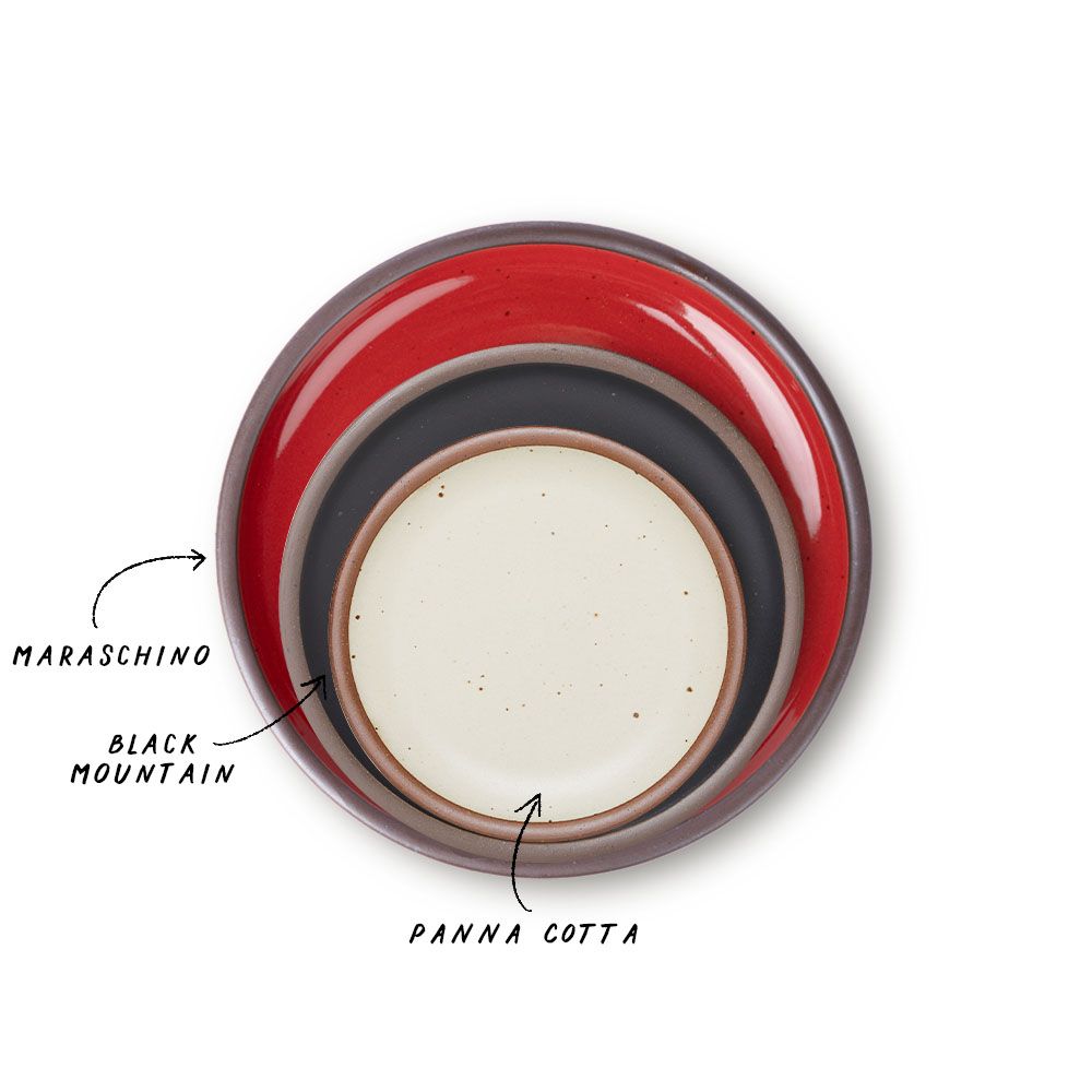 A stack of 3 plates in Dinner, Side, and Cake sizes in a glossy red, graphite black, and off-white colors.