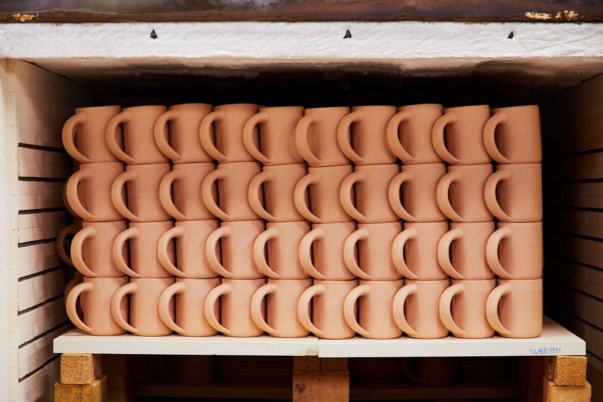 Unfinished East Fork mugs going into kiln at the Asheville, North Carolina factory