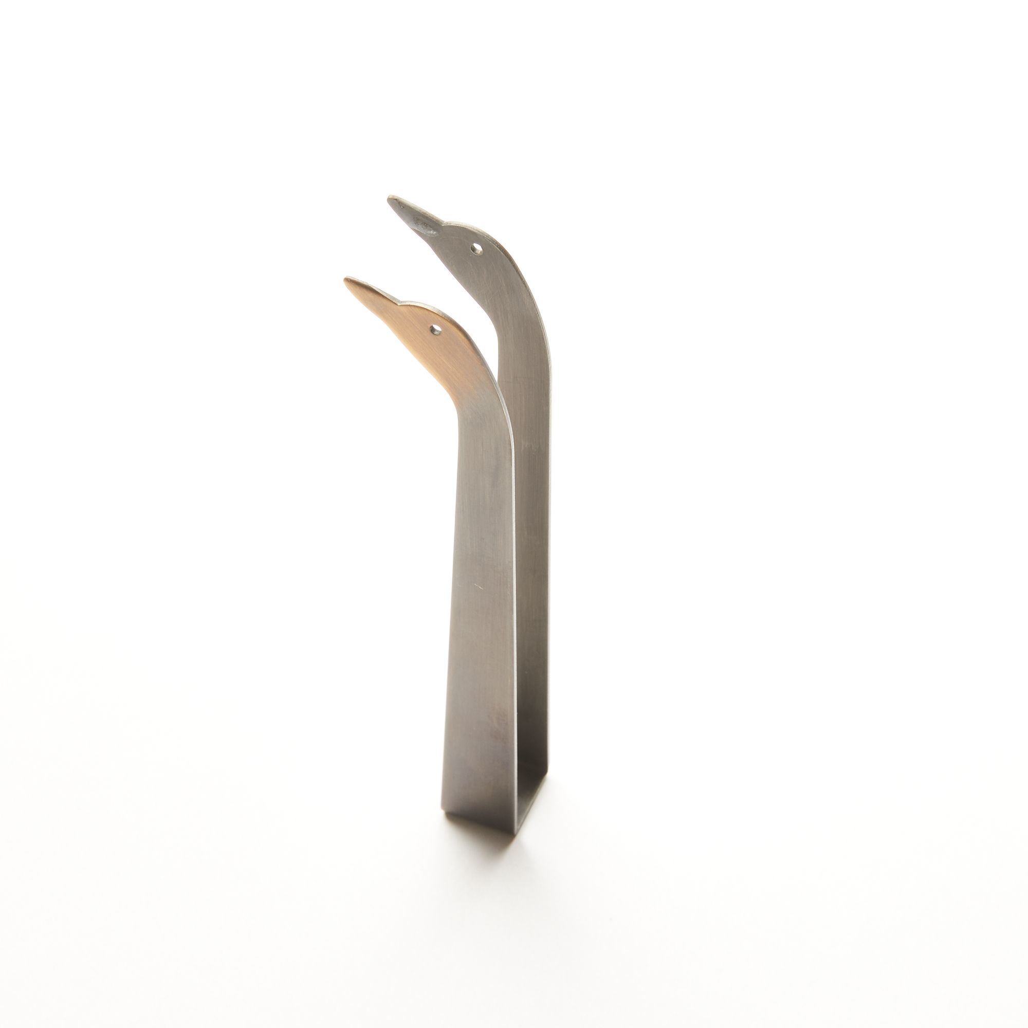 Simple steel clamp candle snuffer with a tip that is a duck head silhouette with eyes