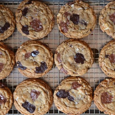 An overhead view of fresh cookies on a baking tray
