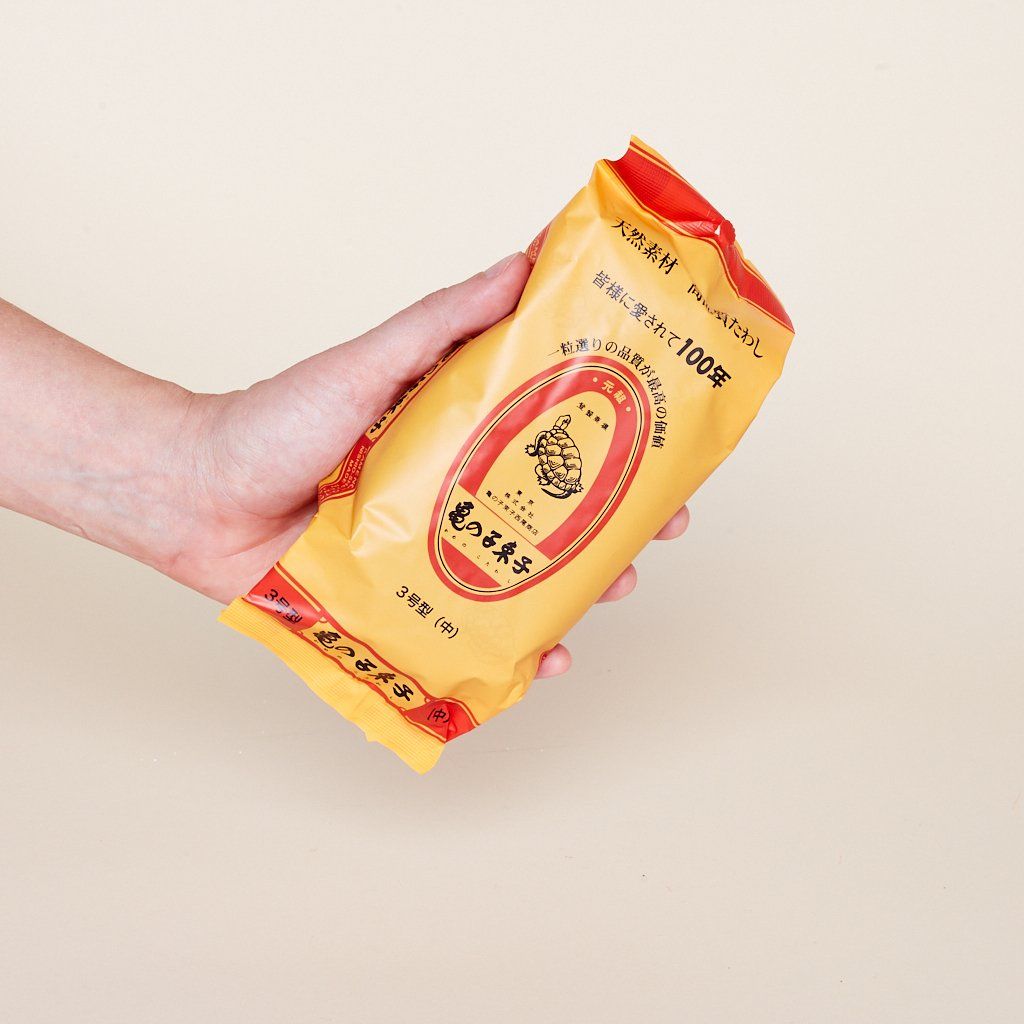 Yellow and red plastic package with black Japanese characters