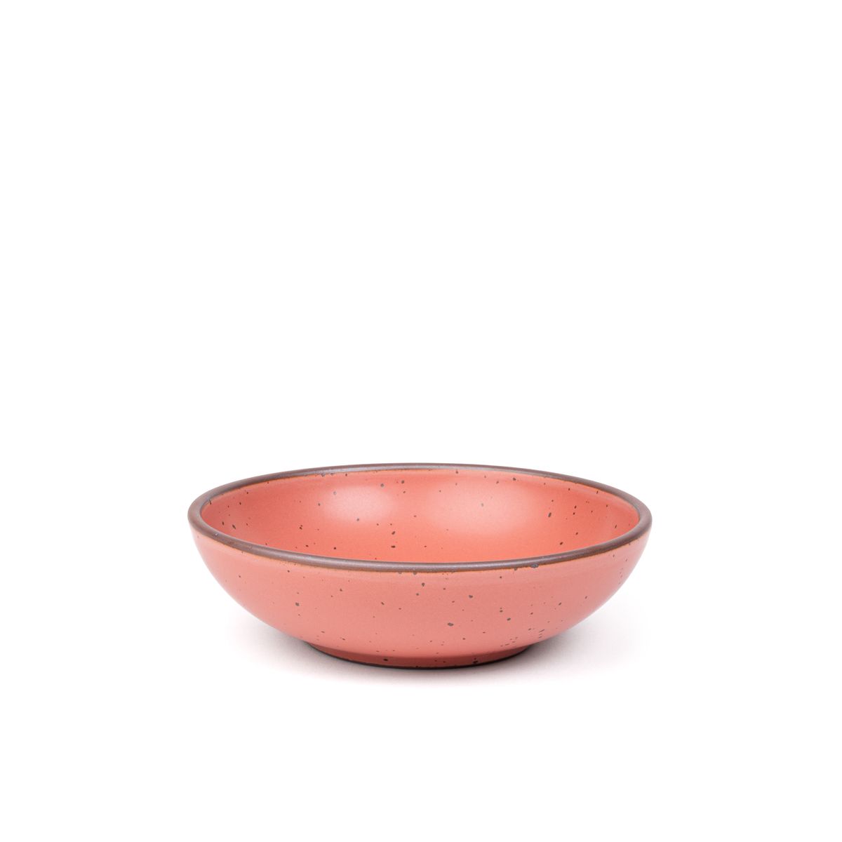 A dinner-sized shallow ceramic bowl in a watermelon pink color featuring iron speckles and an unglazed rim