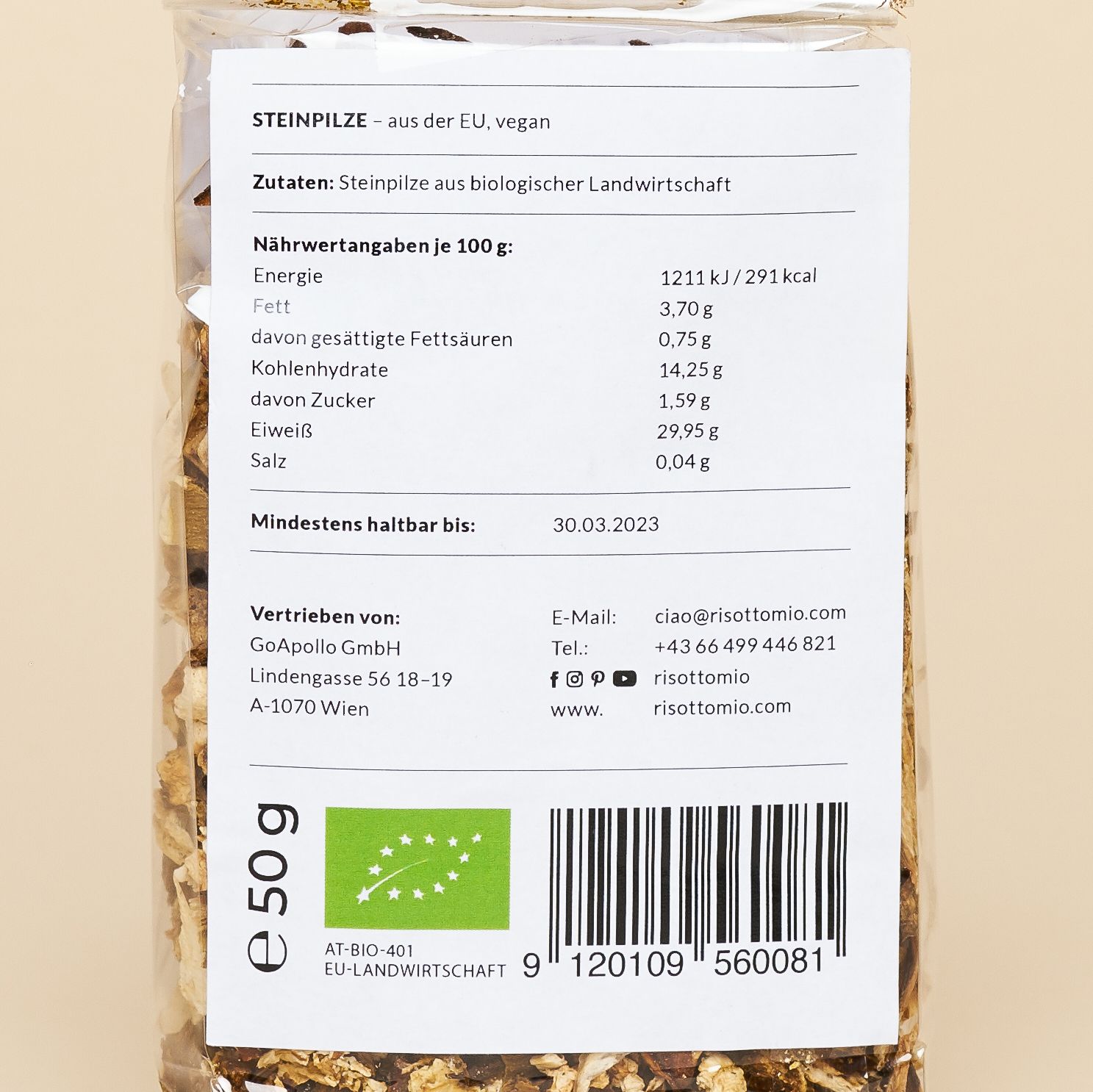 A clear bag with a large white label with a clean, modern Italian label. Inside, dried porcini mushrooms.