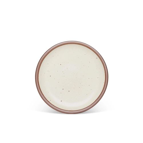 A medium sized ceramic plate in a warm, tan-toned, off-whitecolor featuring iron speckles and an unglazed rim.