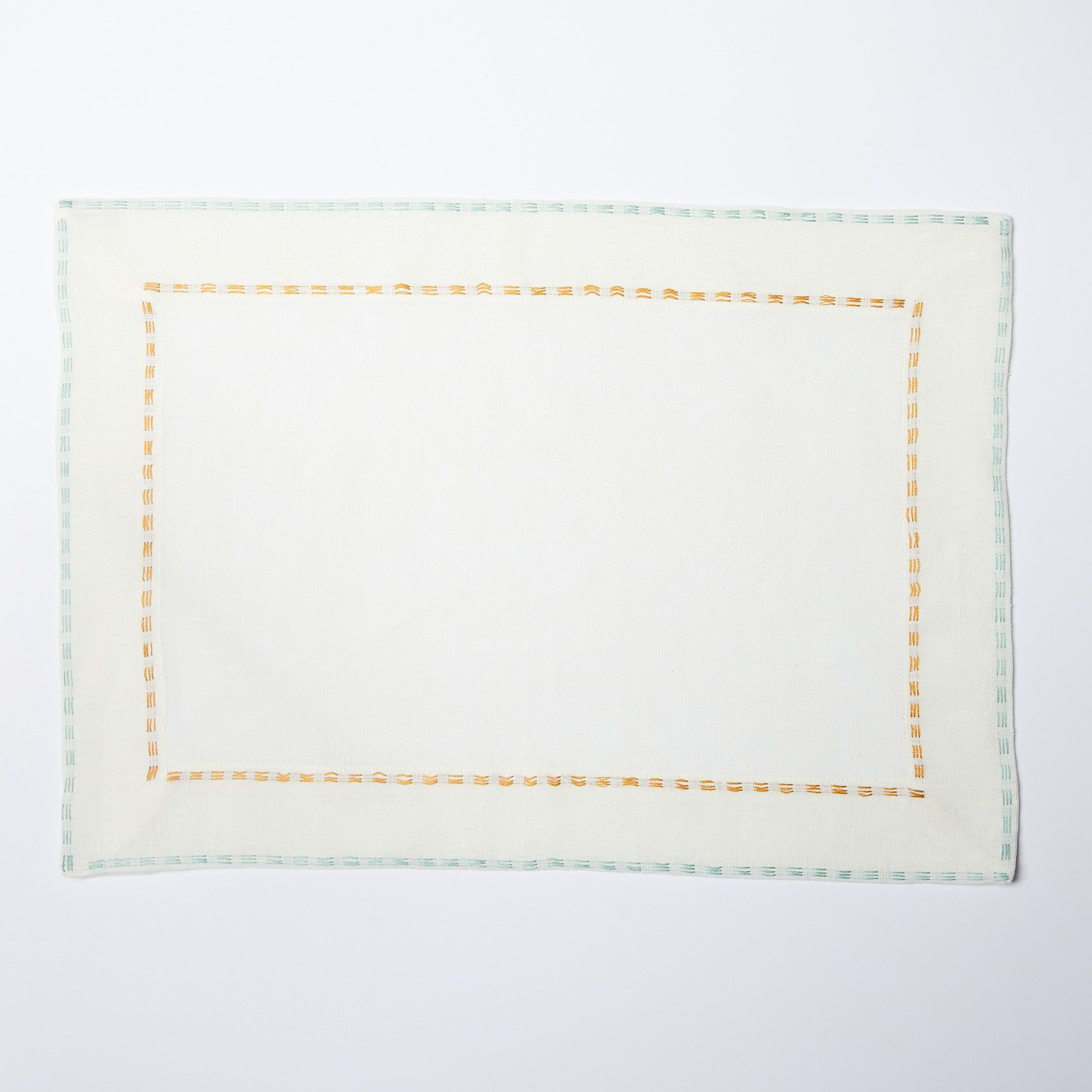 White placemat with aqua border