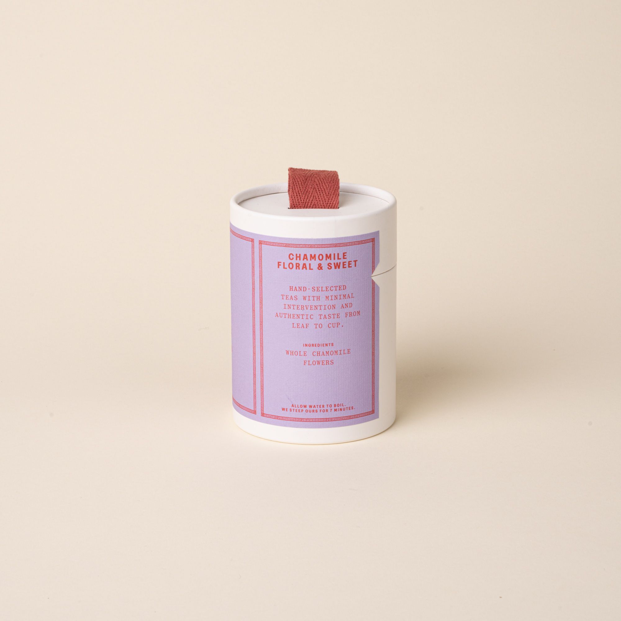 RAAZI Chamomile tea tin with a lavender label and red pull tab, shot on a soft neutral background