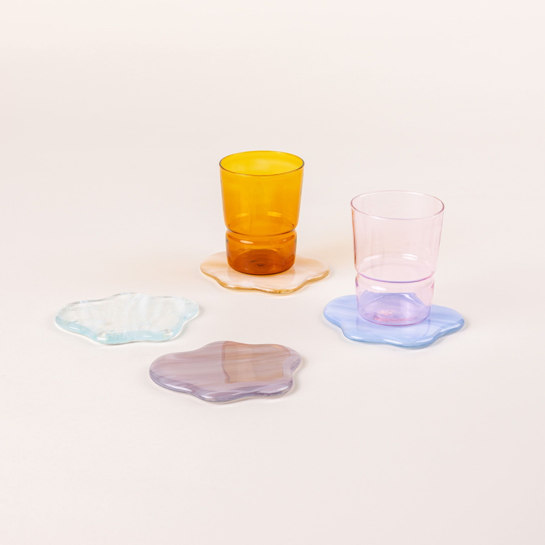 4 glass coasters shaped like clouds with 2 glasses in amber and pink colors