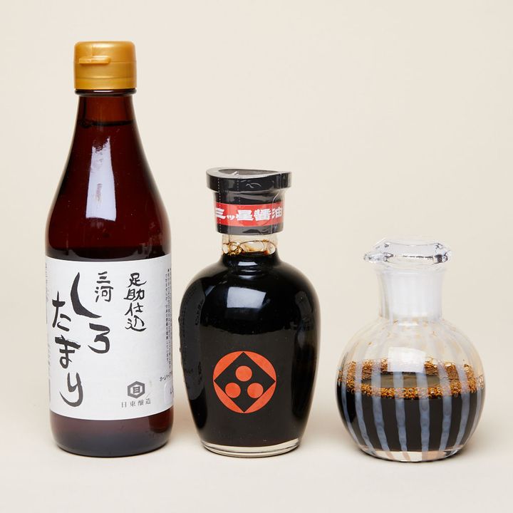 Bottle of Soy Sauce, Bottle of Tamari Sauce, and Soy Sauce Cruet in a line