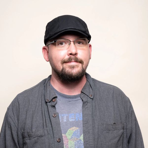 A headshot of Ken H.