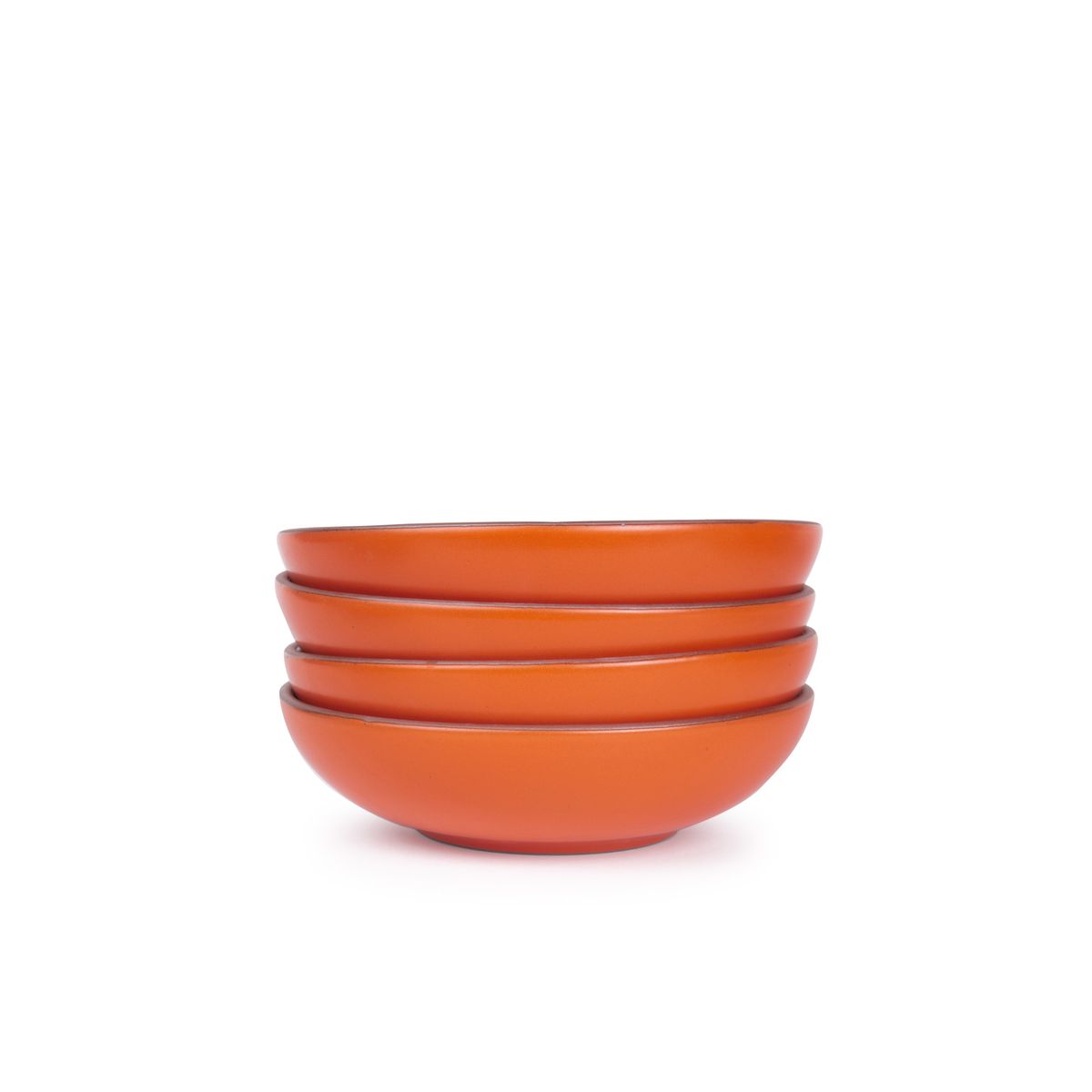 A stack of 4 dinner-sized shallow ceramic bowls in a bold orange color featuring iron speckles and an unglazed rim
