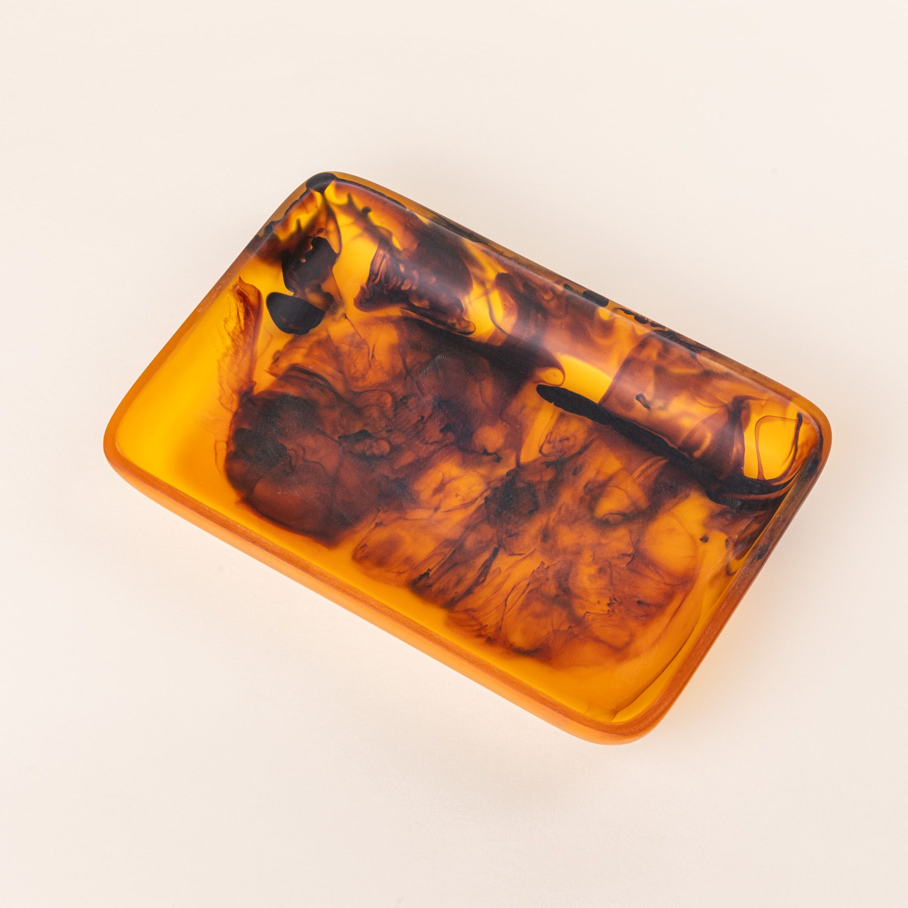 A rectangular tortoiseshell tray with curved corners