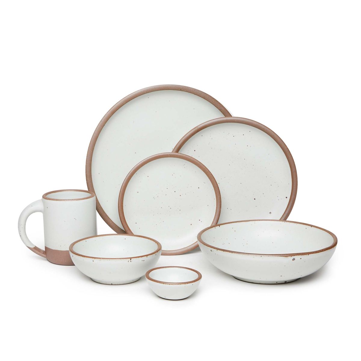 The Mug, bitty bowl, breakfast bowl, everyday bowl, cake plate, side plate and dinner plate paired together in a cool white color featuring iron speckles