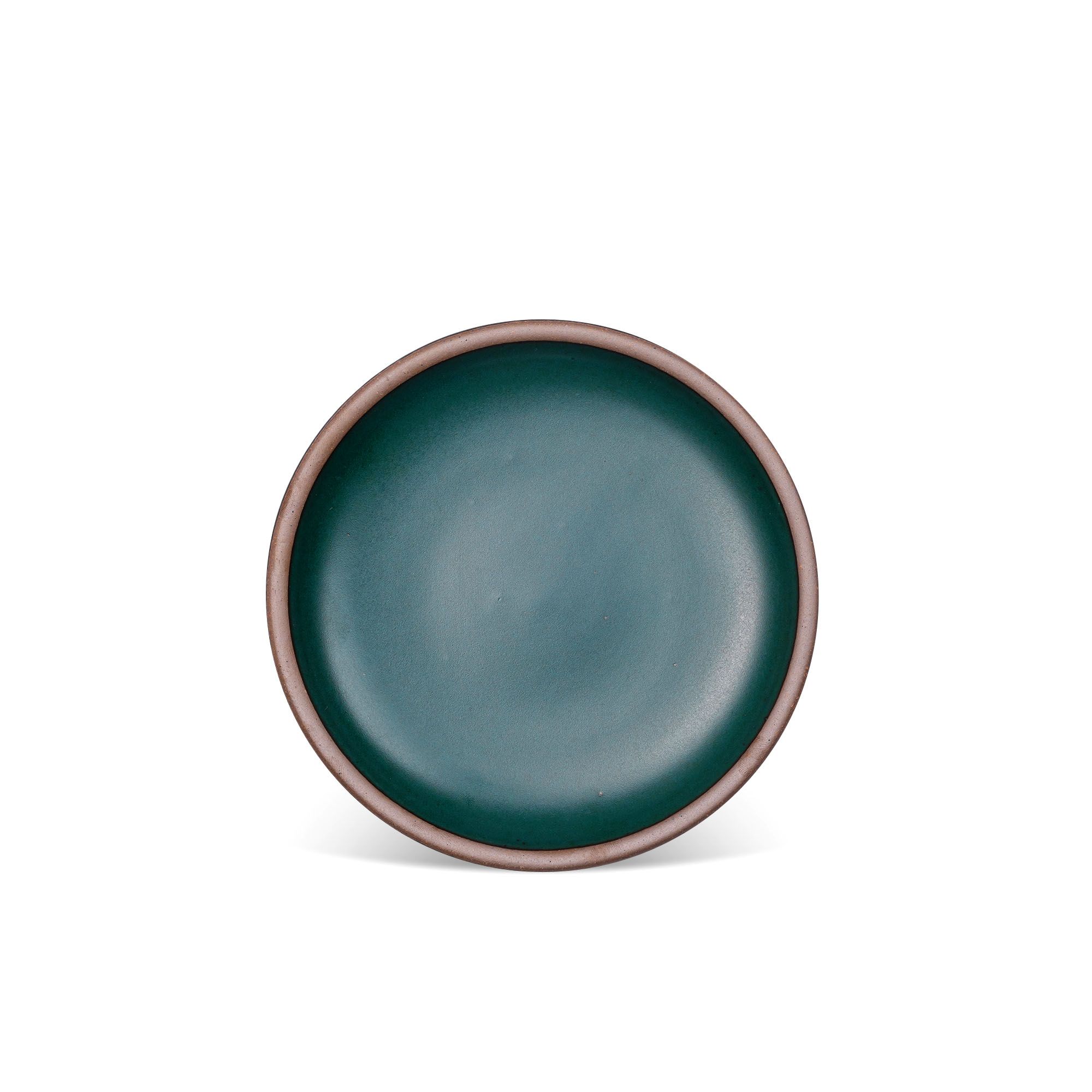A medium sized ceramic plate in a deep dark teal color featuring iron speckles and an unglazed rim.