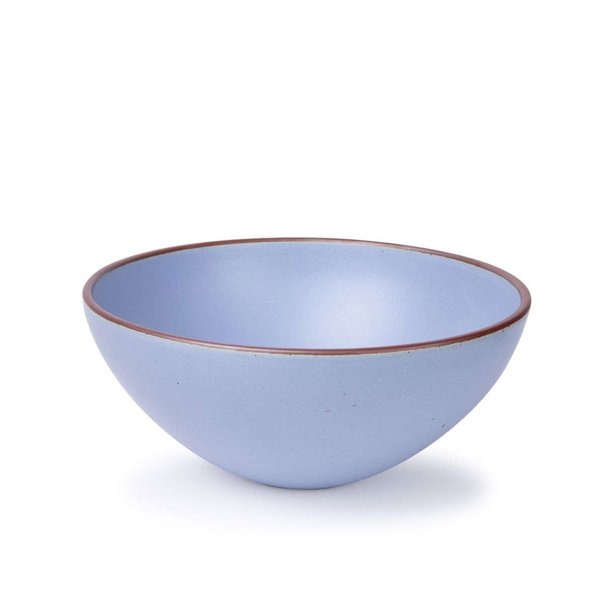 A large ceramic mixing bowl in a periwinkle color featuring iron speckles and an unglazed rim