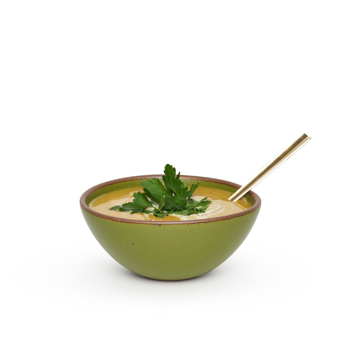 Soup Bowl in Fiddlehead, filled with butternut squash soup garnished with flat italian parsley