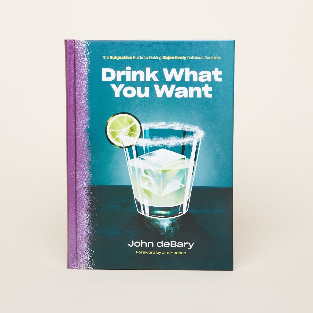The front cover of the book "Drink What You Want" showing a mixed drink