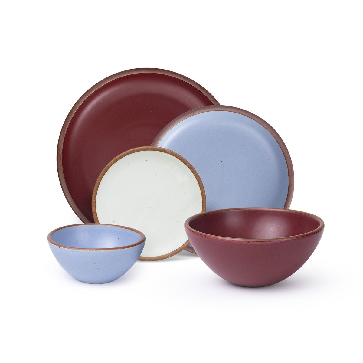 An ice cream bowl and side plate in a periwinkle, a soup bowl and dinner plate in a plum, and a cake plate in a cool white color.