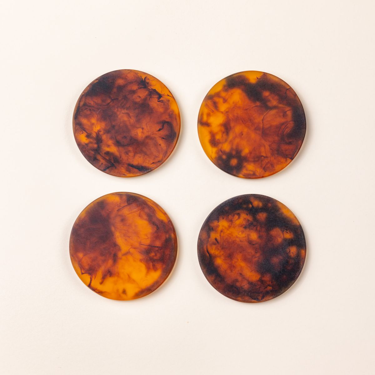 4 circular tortoiseshell coasters