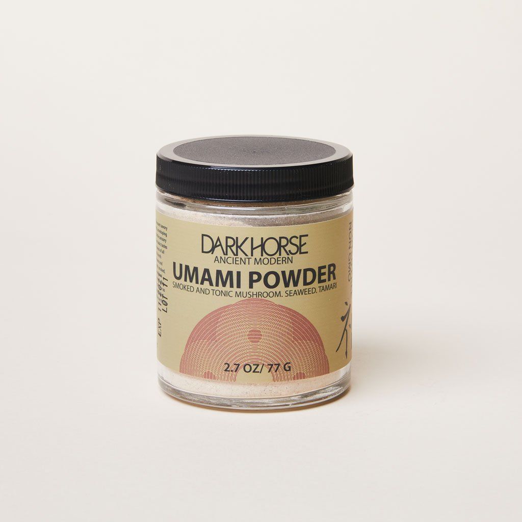 Dark Horse Ancient Modern Umami Powder in a glass jar with a black lid