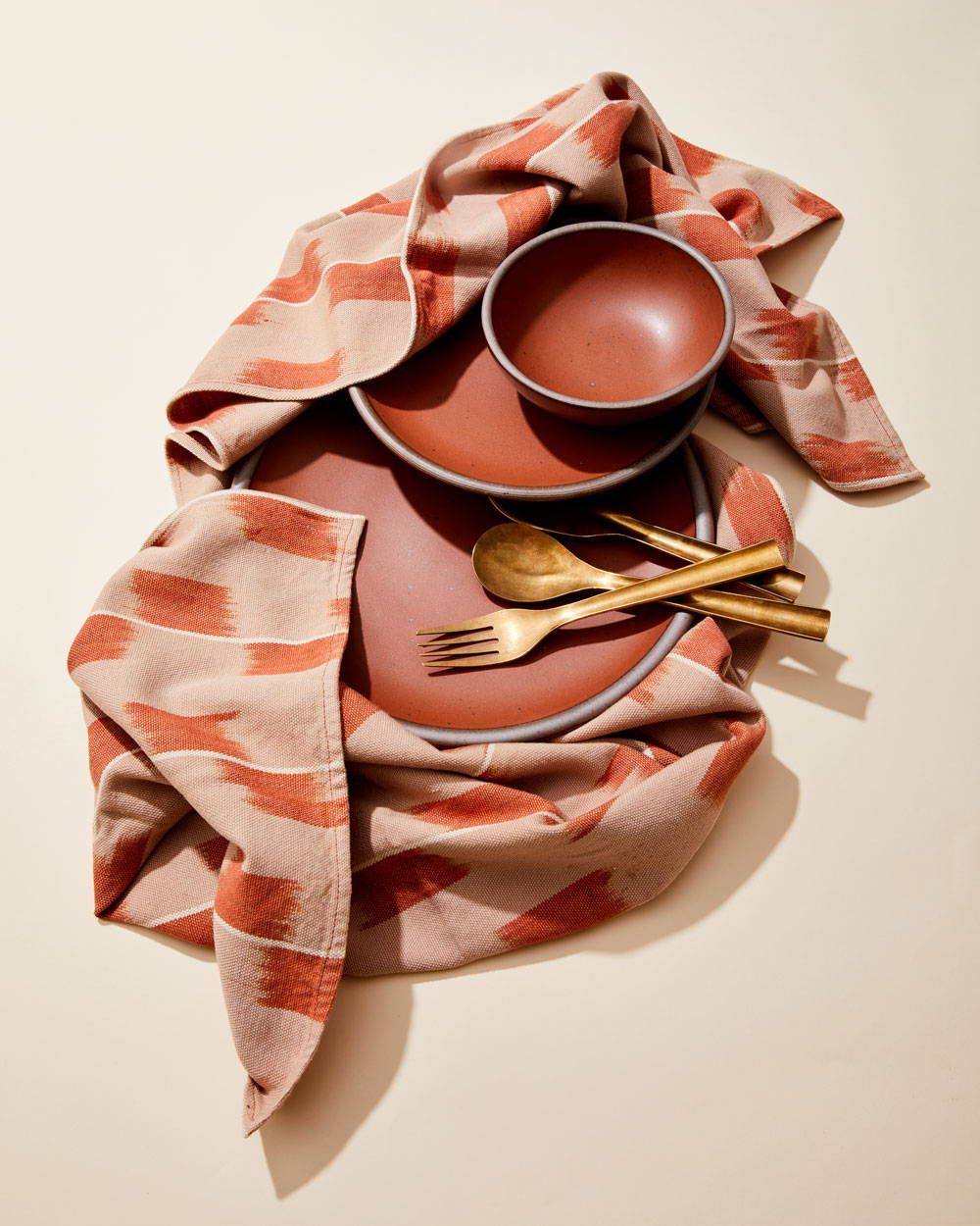 East Fork Plates in Amaro with Matching Textile and Brass Silverware