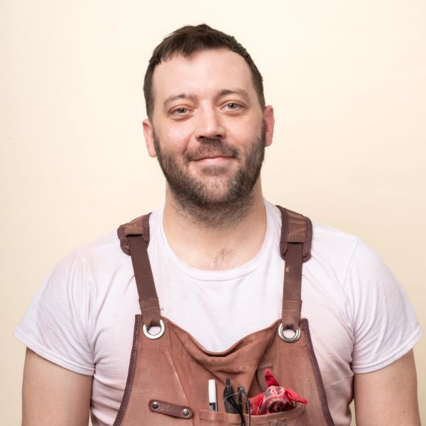 A headshot of Justin M.