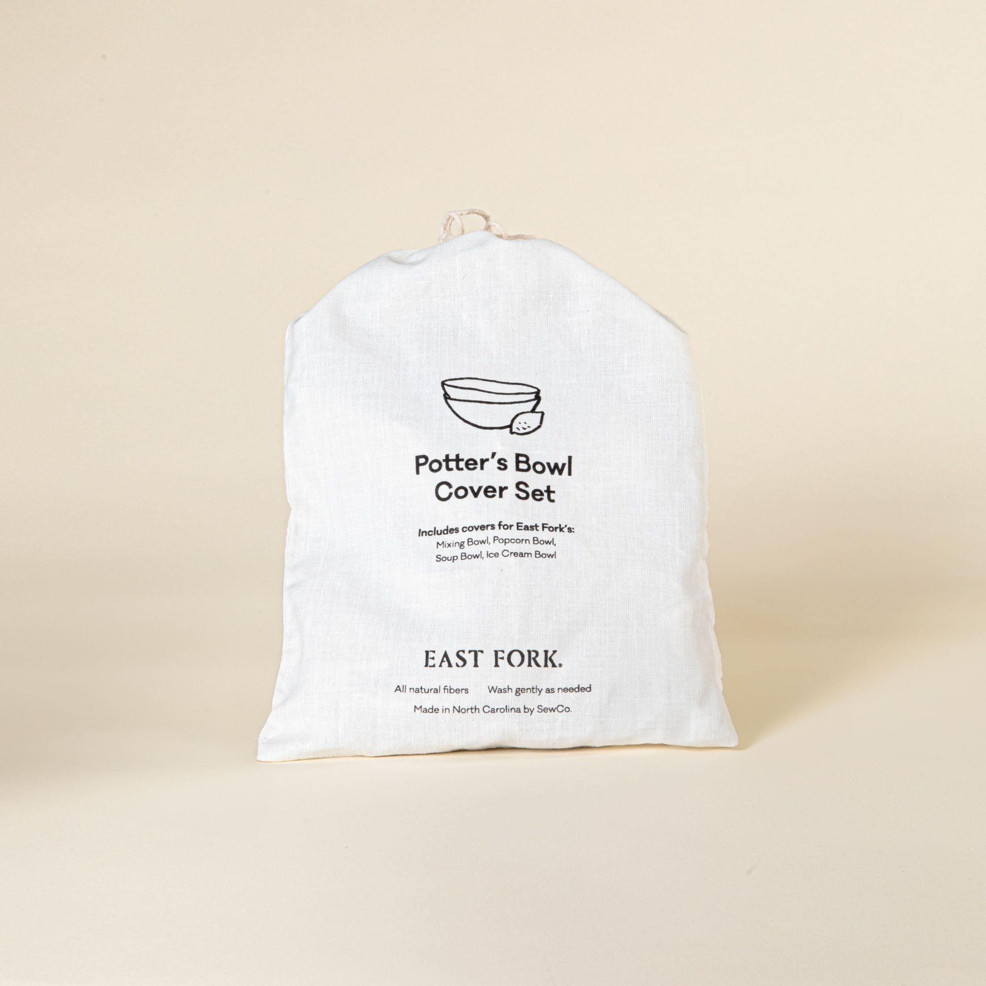 White linen drawstring bag that says Potter's Bowl Cover Set with product details
