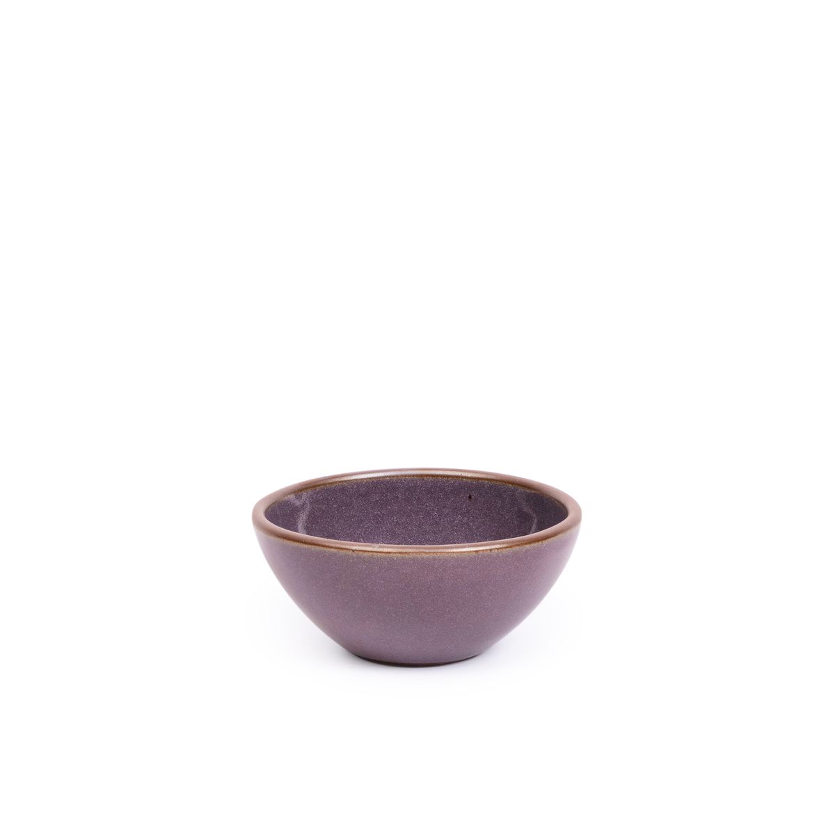A small dessert sized rounded ceramic bowl in a purple color with a soft glowing sheen and an unglazed rim