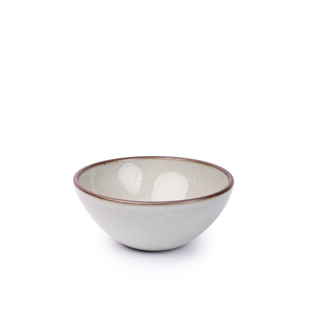 A medium rounded ceramic bowl in a reflective icy off-white color featuring iron speckles and an unglazed rim