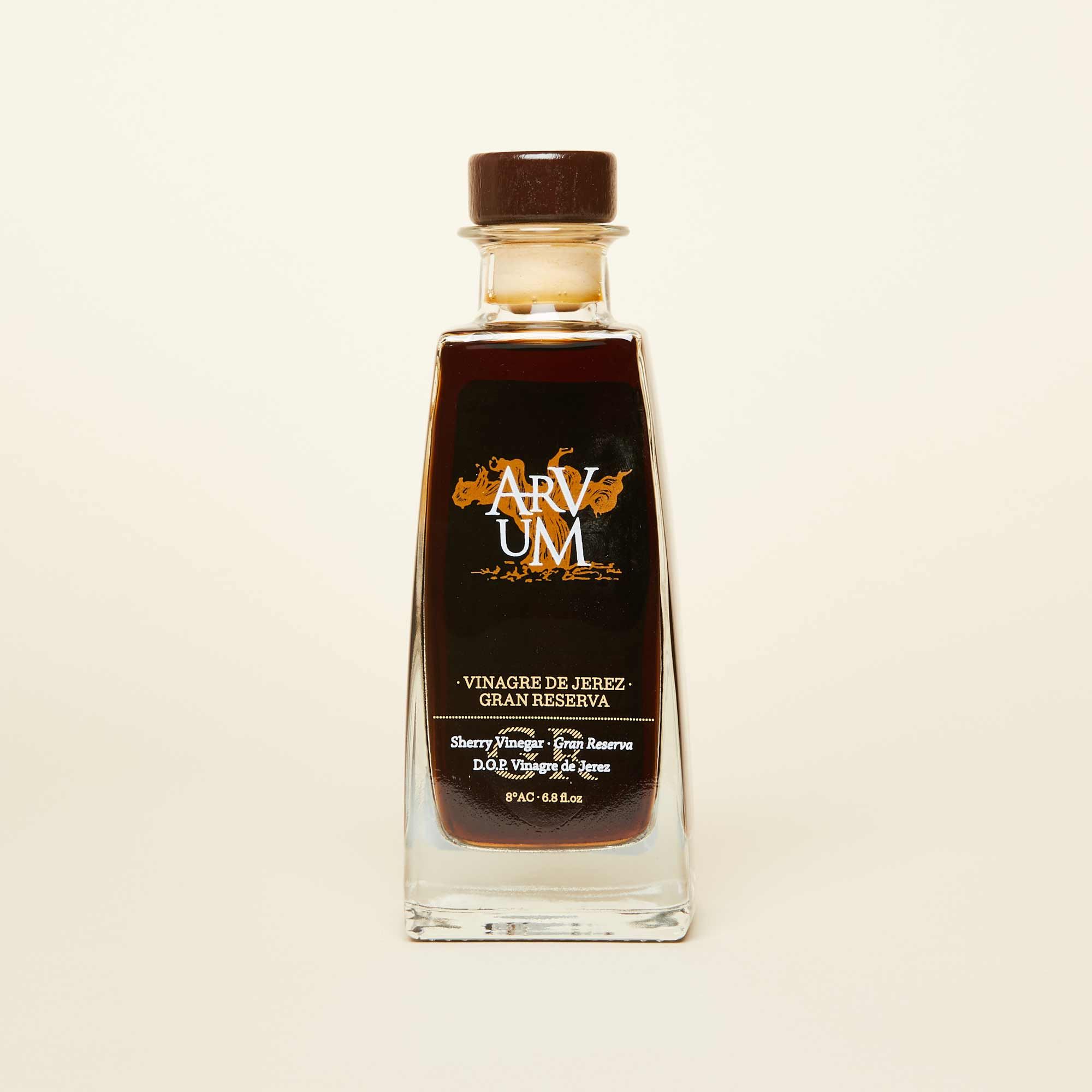 A bottle of dark brown vinegar with a dark brown cap