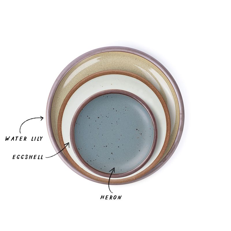 A stack of 3 plates in Dinner, Side, and Cake sizes in a reflective dappled grey-green, cool white, and blue-grey.