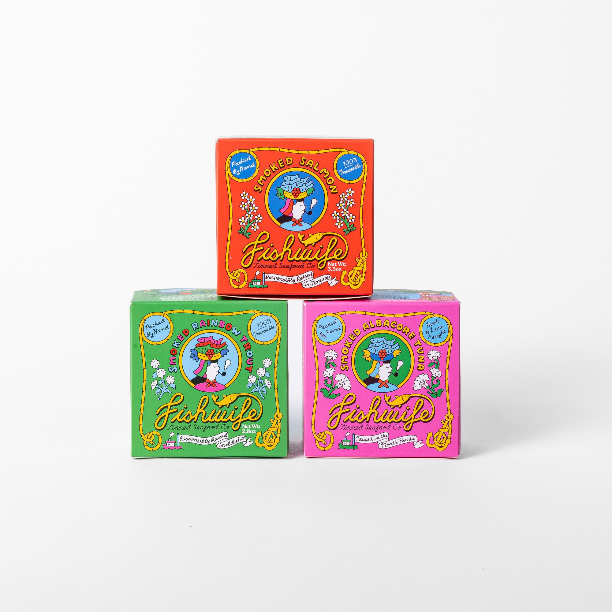 3 square boxes stacked in a pyramid in red, green, and pink colors.