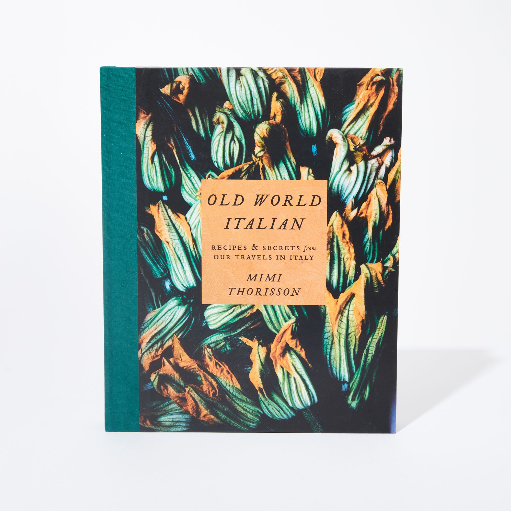 Book Cover - Teal binding, yellow square in center with writing, teal and yellow flower outlines in the background