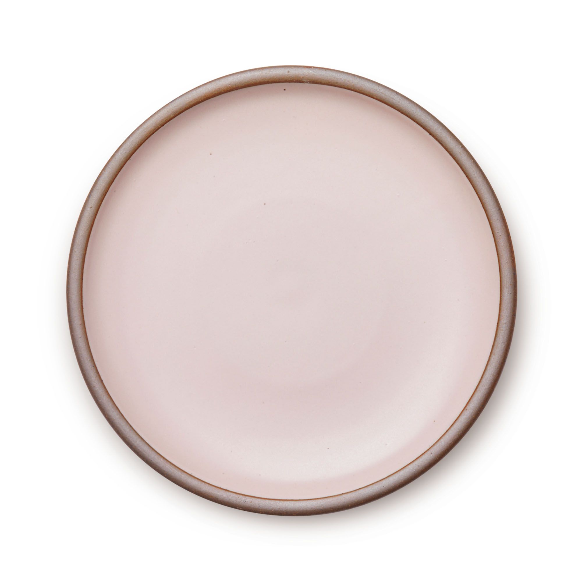 A large ceramic platter in a pale baby pink color featuring an unglazed rim.