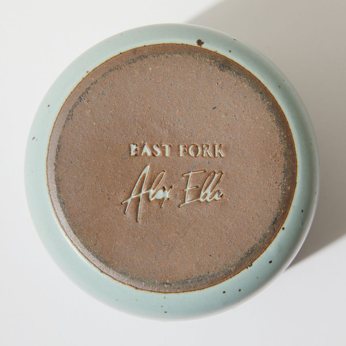 Bottom of the cup features raw unglazed rim with a stamp for "East Fork" and "Alex Elle"