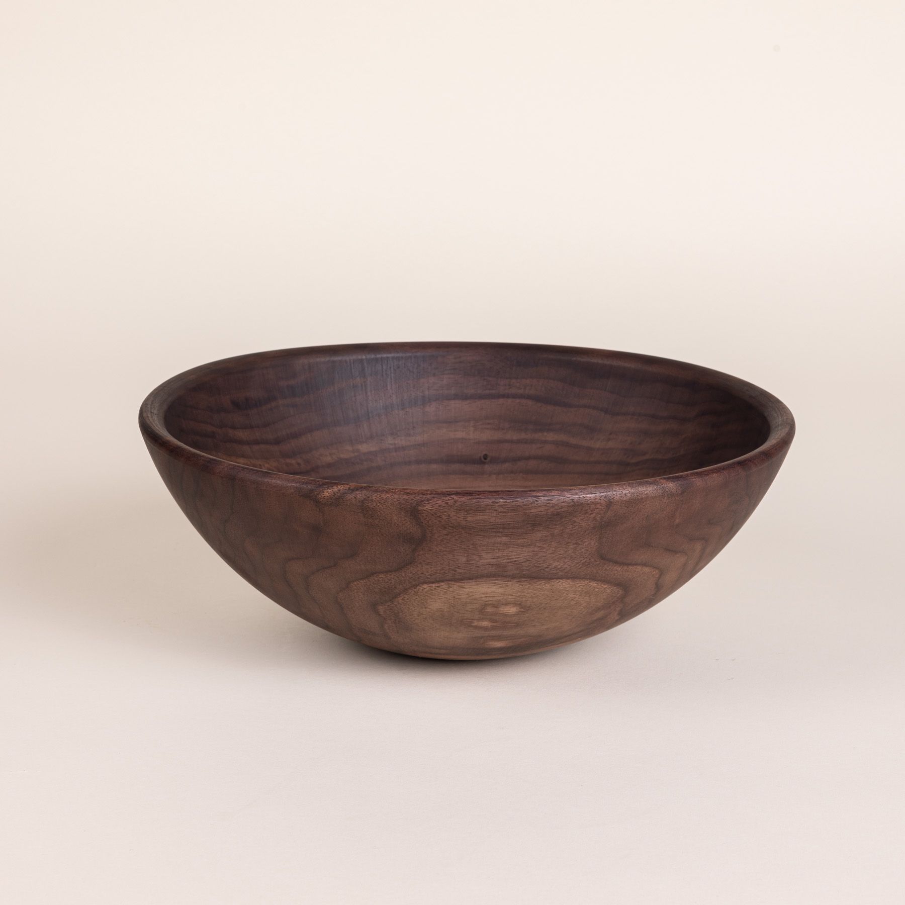 A large walnut wooden bowl