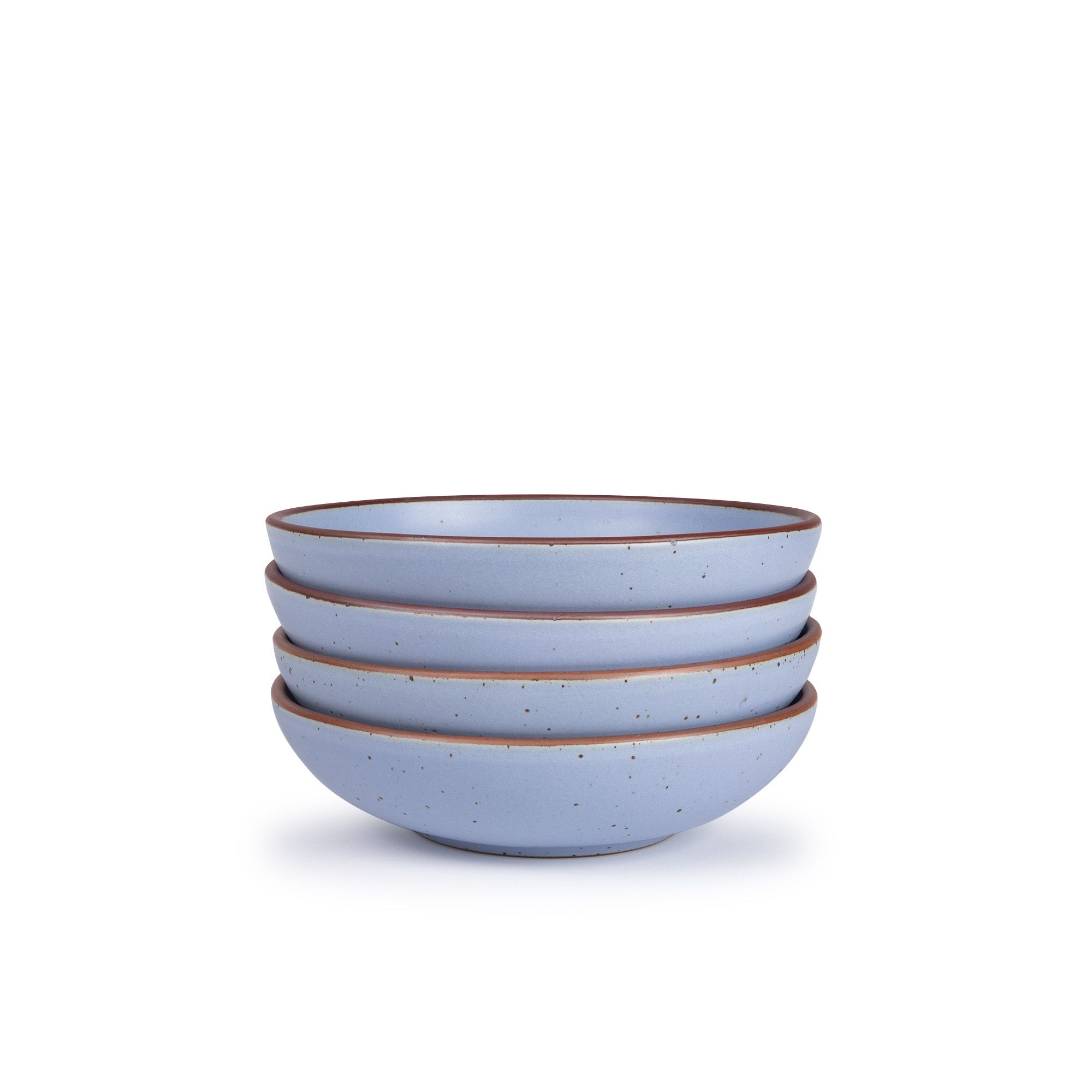 A stack of 4 dinner-sized shallow ceramic bowls in a periwinkle color featuring iron speckles and an unglazed rim