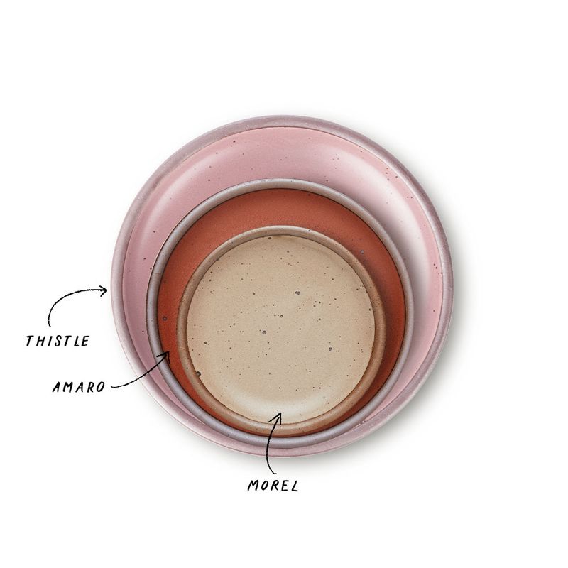 A stack of 3 plates in Dinner, Side, and Cake sizes in a dusty mauve pink, cool terracotta and warm pale brown colors.